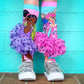 Fashionista Barbie socks featuring colorful patterns and attached 3D tutu skirts.