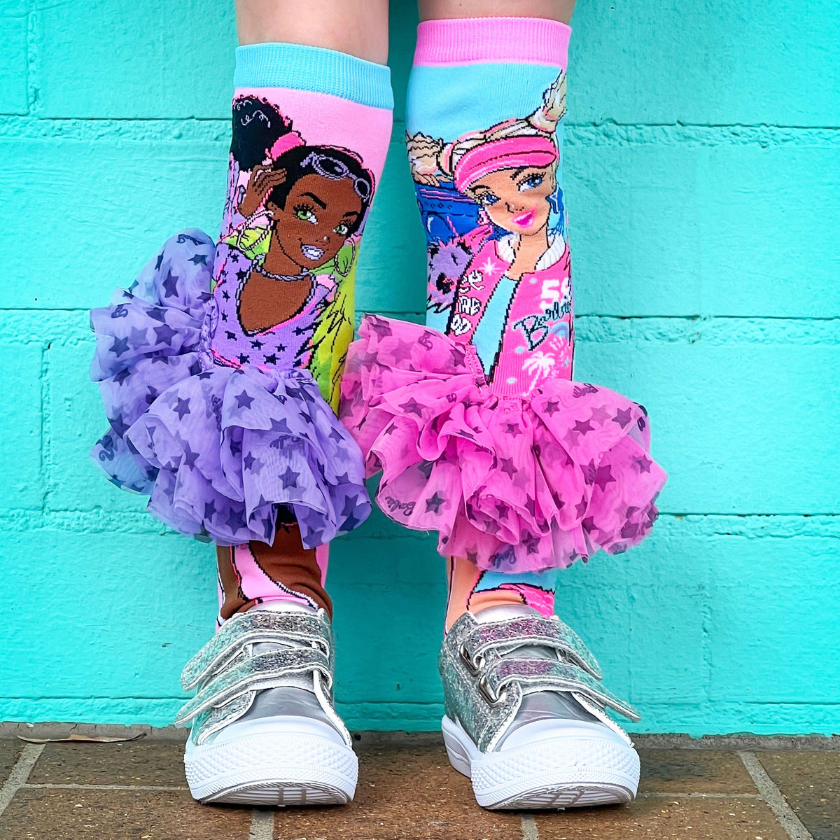Fashionista Barbie socks featuring colorful patterns and attached 3D tutu skirts.