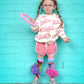 Colorful Barbie knee high socks with playful fashion-inspired graphics and tutu details.