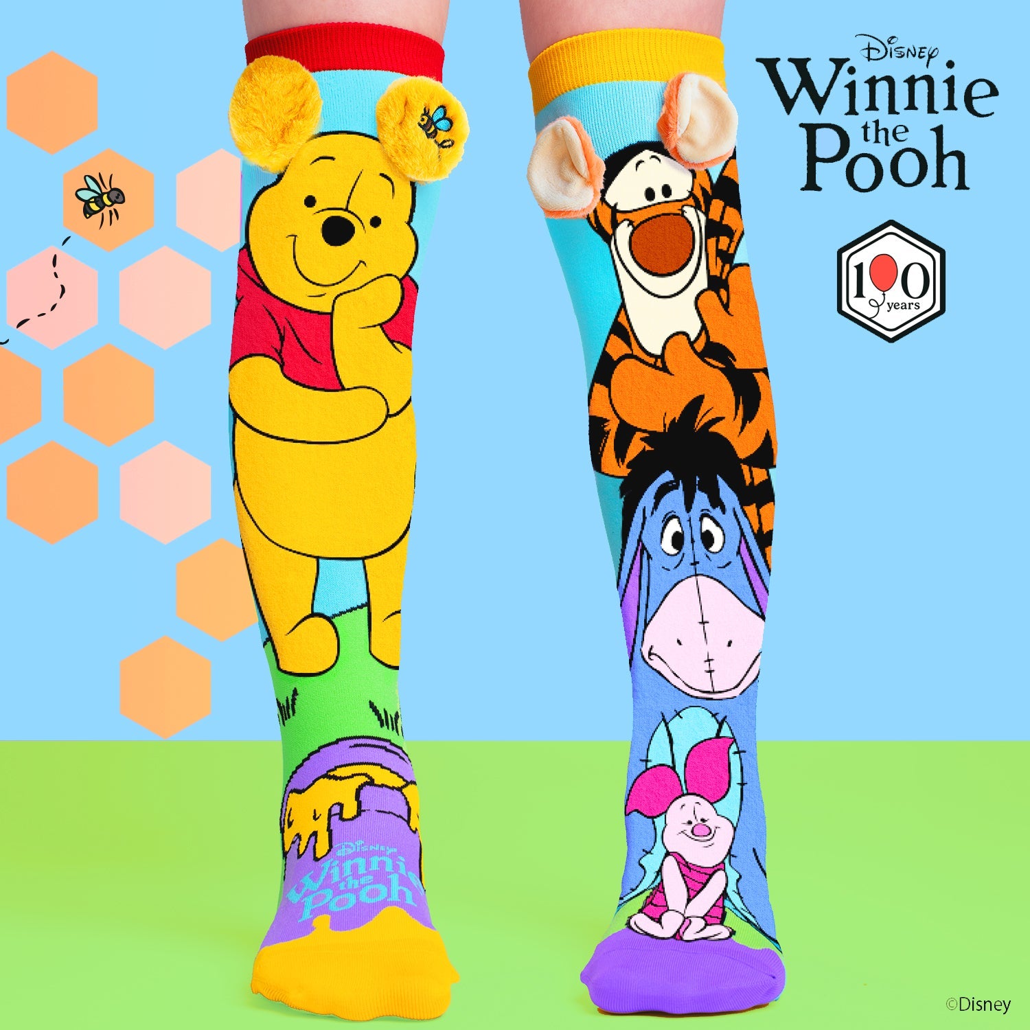 Colorful Disney Winnie the Pooh knee high socks featuring Pooh, Tigger, Eeyore and Piglet with plush 3D ears